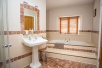 Upstairs bathroom with bath at Decoy Country Cottages